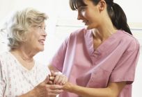 A nurse providing aged care with a resident in Auckland